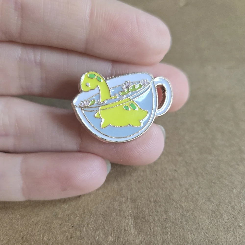 Cute Dinosaur in Teacup Enamel Pin